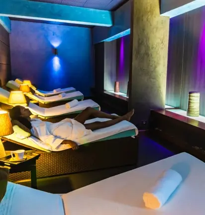 Spa relaxation room with colorful ambient lighting. Mahogany Hôtel Résidence & Spa, Pointe de la Verdure, Le Gosier.