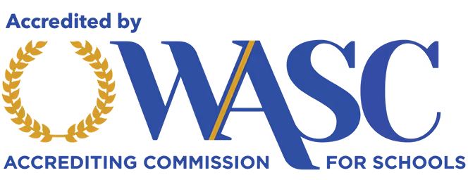 Accredited by WASC Accrediting Commission for Schools logo with gold laurel wreath and blue text.