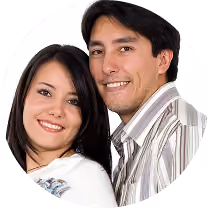 Smiling young man and woman posing closely together with white background.