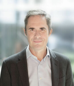 Portrait of Simon Clark, new Vice-President of Polpharma, in a dark jacket and open-collar shirt