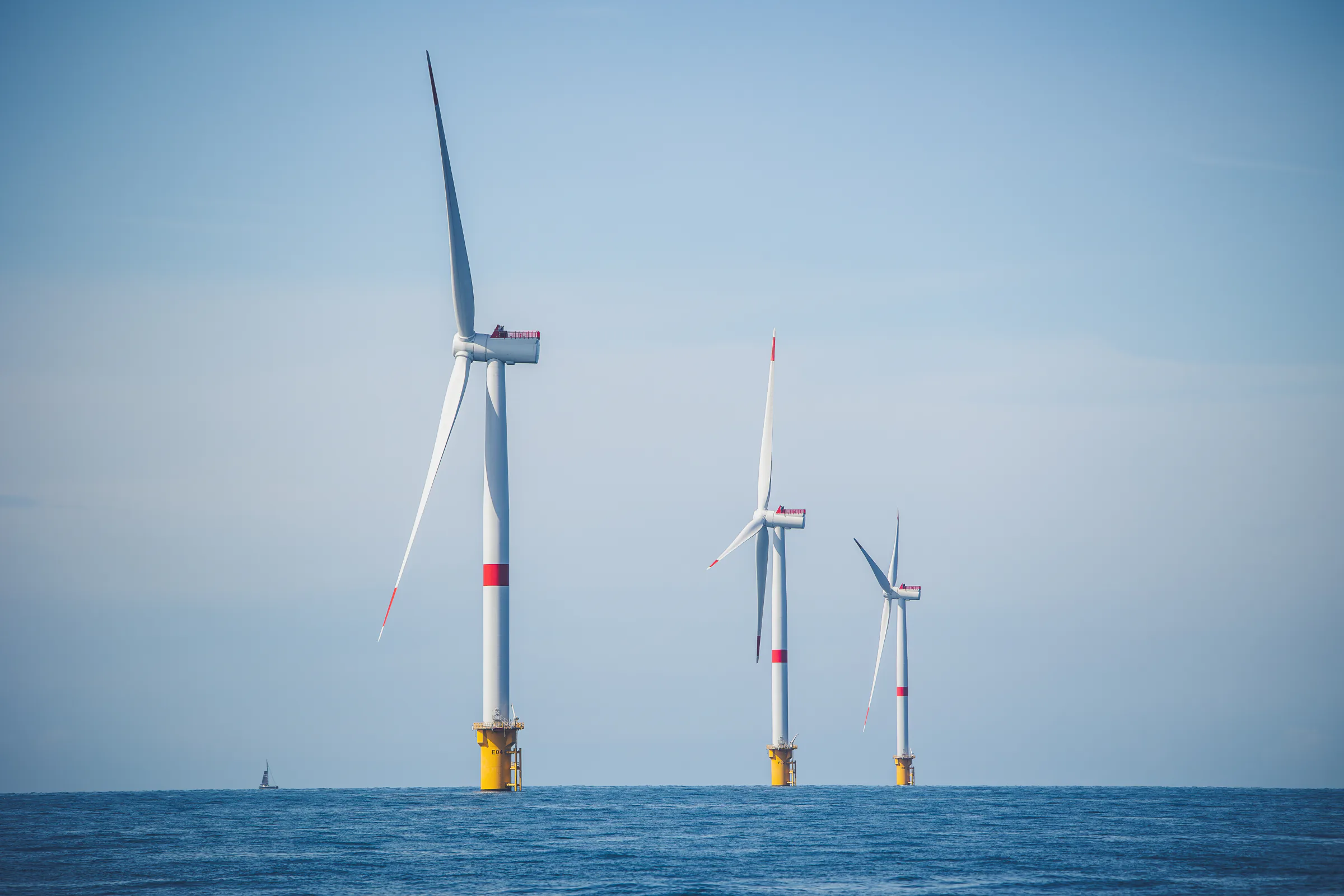 Three offshore wind turbines at Fécamp wind farm.