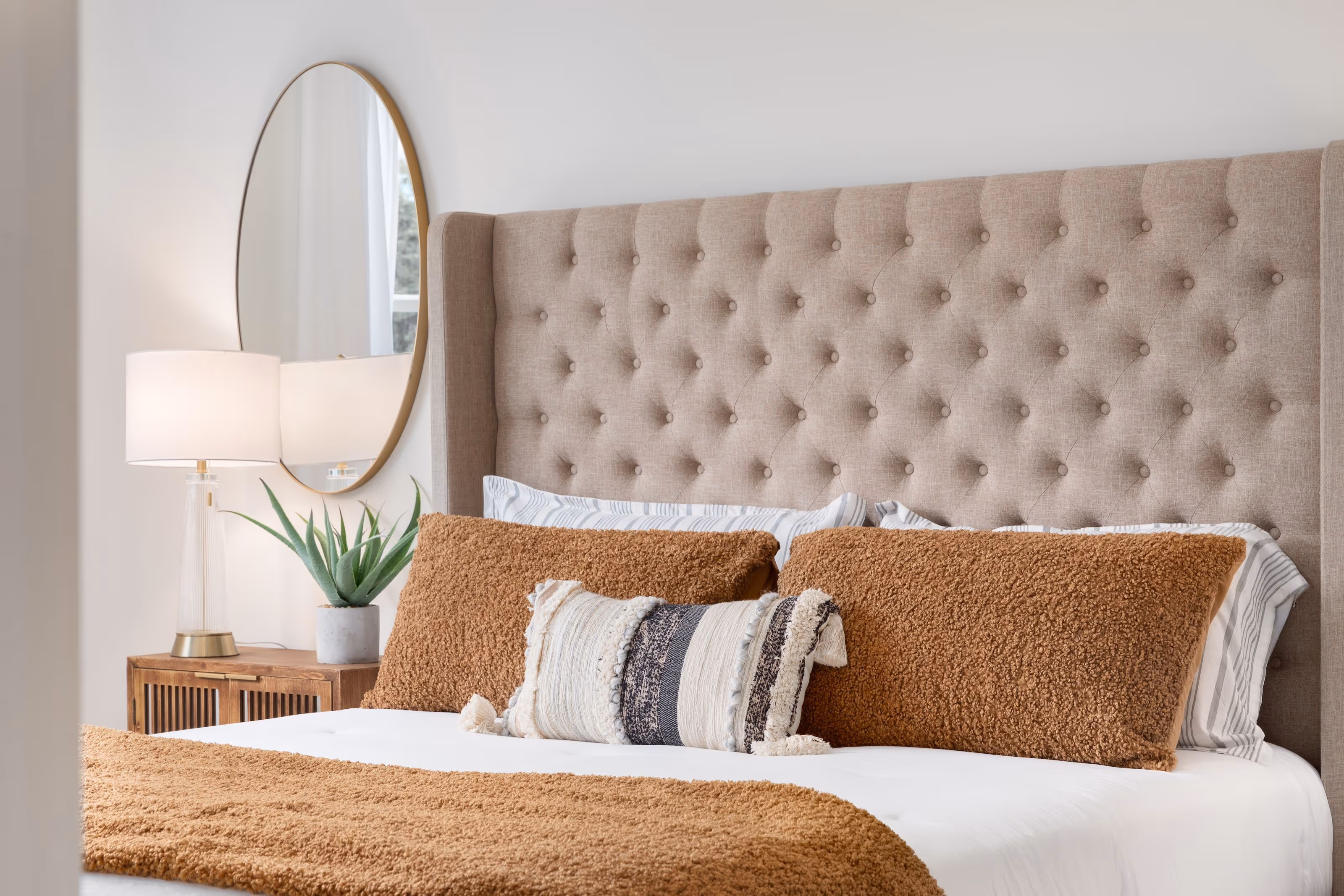 Bedroom with bed, mirror and lamp stock image