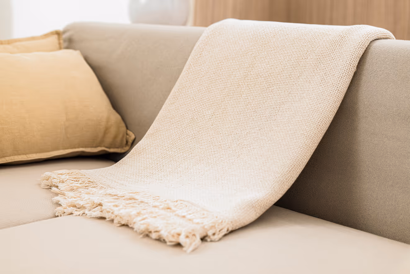 Blankets on sofa stock image