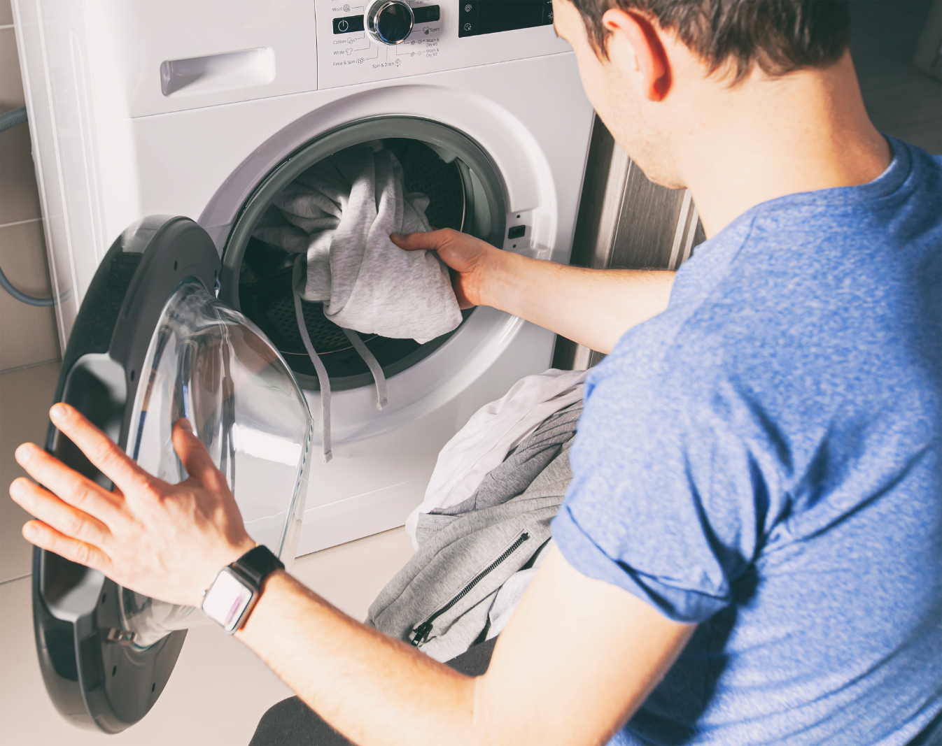 Man doing laundry stock image