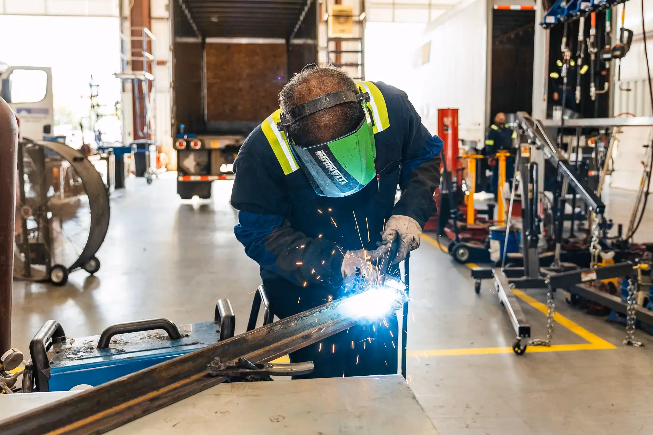 Mechanic performing welding service in Britton, MI