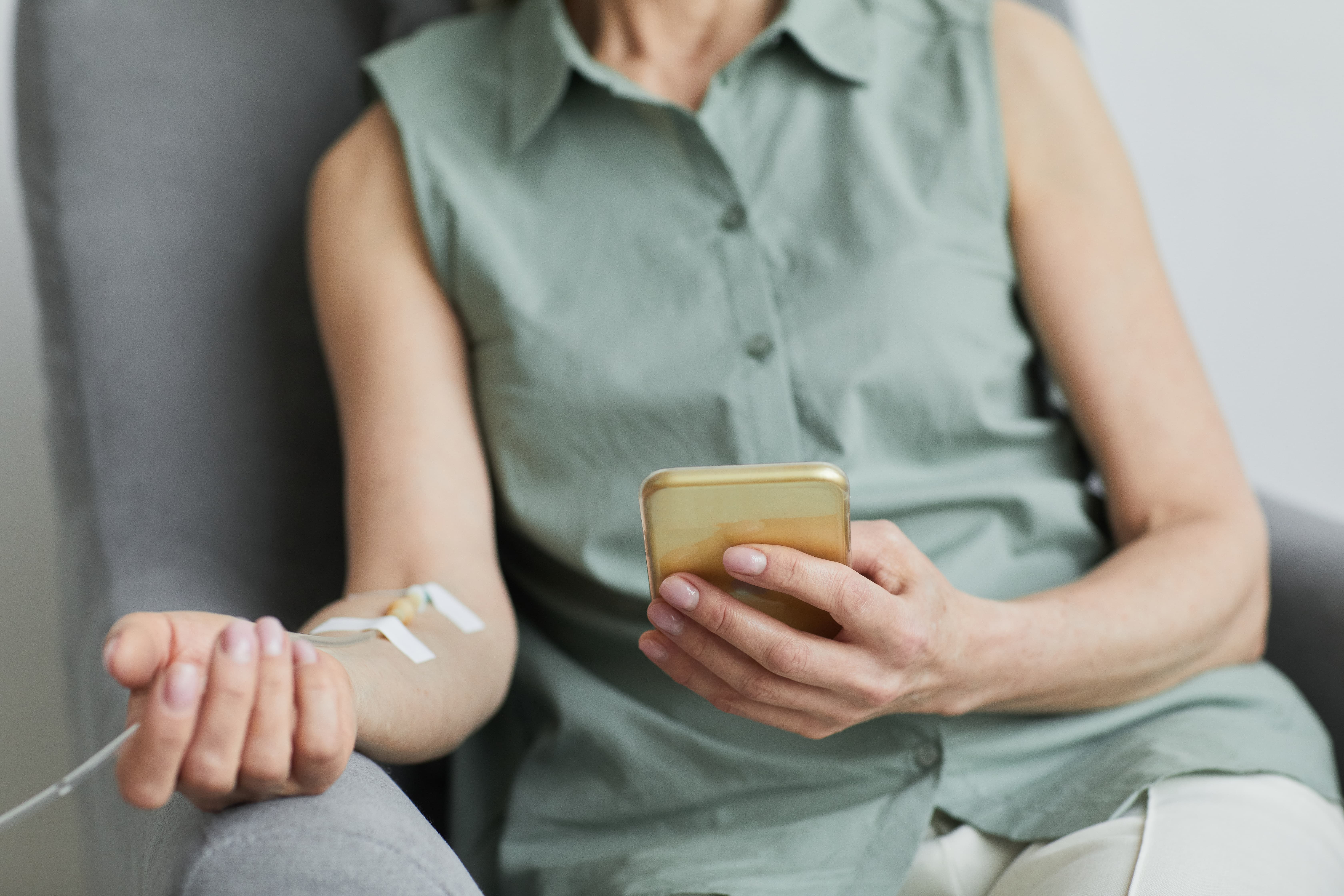 Patient receiving an IV therapy drip in a relaxed treatment room