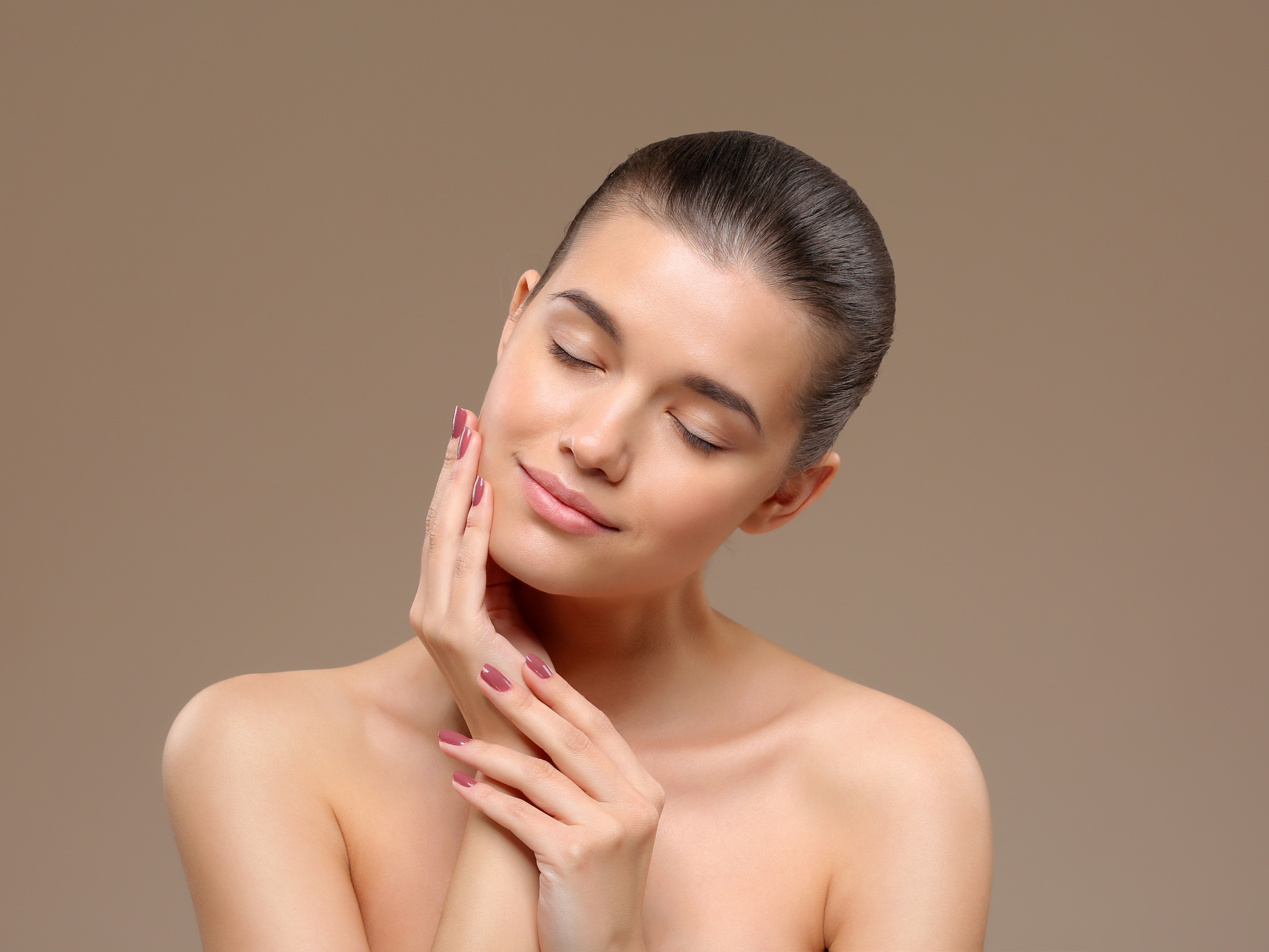 Chemical peel solution being applied to a patient's face