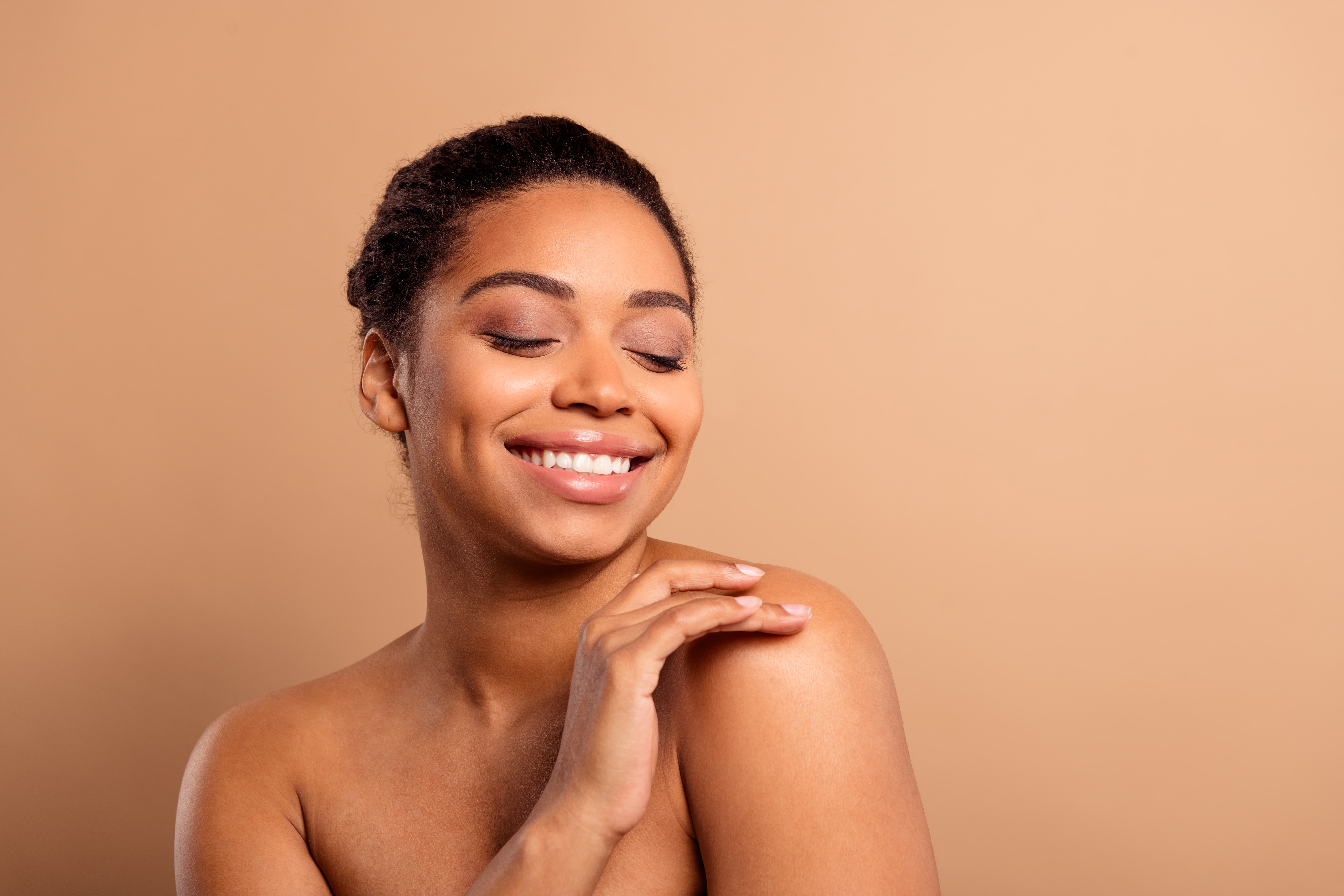 Woman with a radiant complexion after a DiamondGlow facial