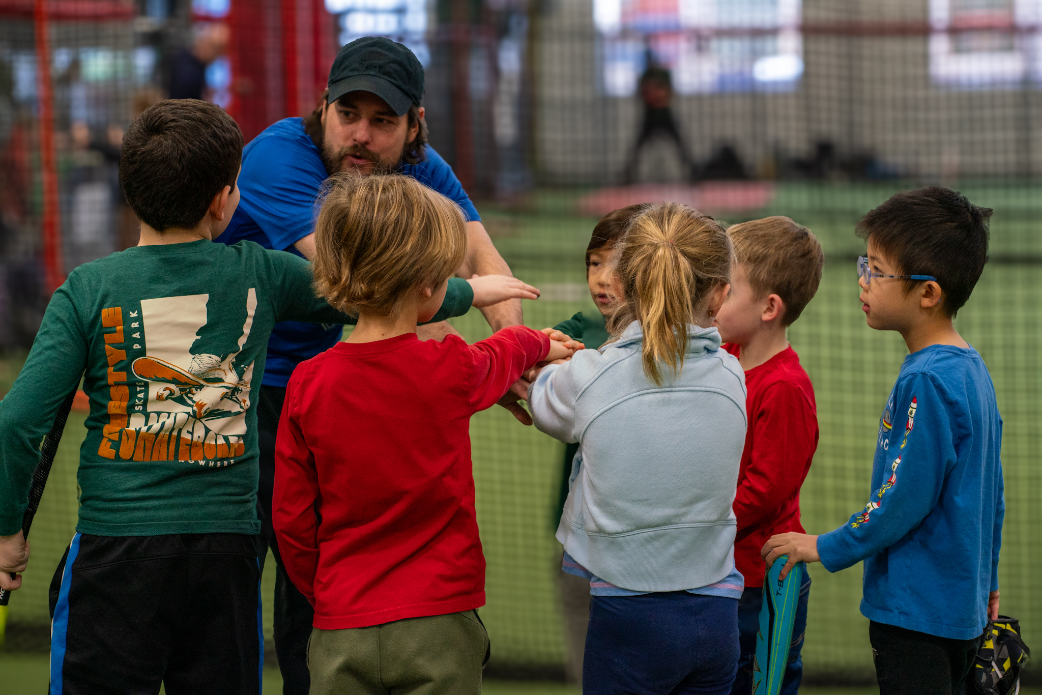Youth athletes huddled together at Windy City Sports Academy