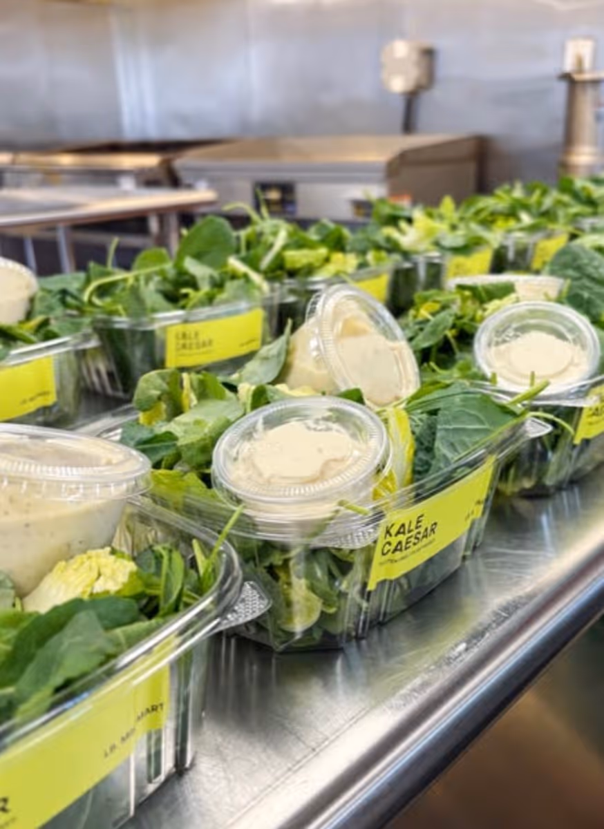 Prepared salads and greens in the cooler