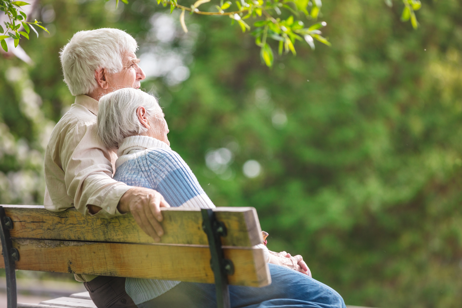 Couple sitting on bench stock image