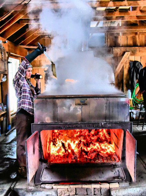 a sugar maker hard at work in a sugar shack in Temecula dentist, Dr. Dave Cutts' home state of Vermont