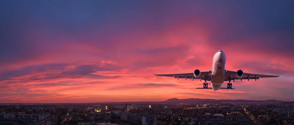 jetliner taking off with beautiful sunset behind