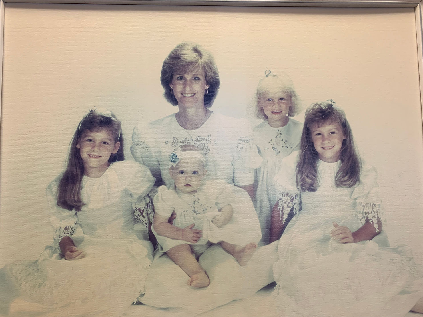 Early 1990's photo of Debby Cutts, wife of Temecula dentist Dr. Dave Cutts, and their four young daughters smiling in a family portrait