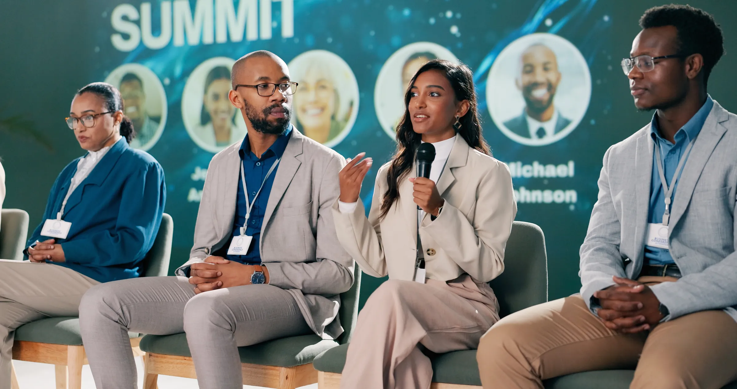 Panel of speakers in conversation on stage