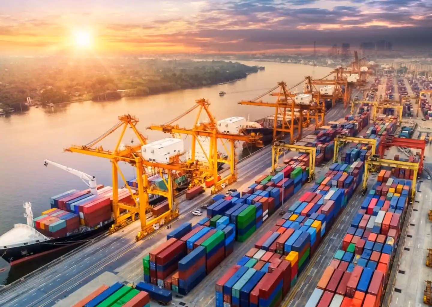 Cargo containers and cranes operating at a major shipping port.
