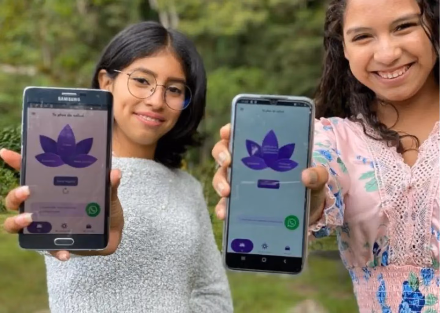 Two young women holding smartphones displaying the Lily Project mobile app, designed to provide accessible and confidential sexual health resources for young Latinas.