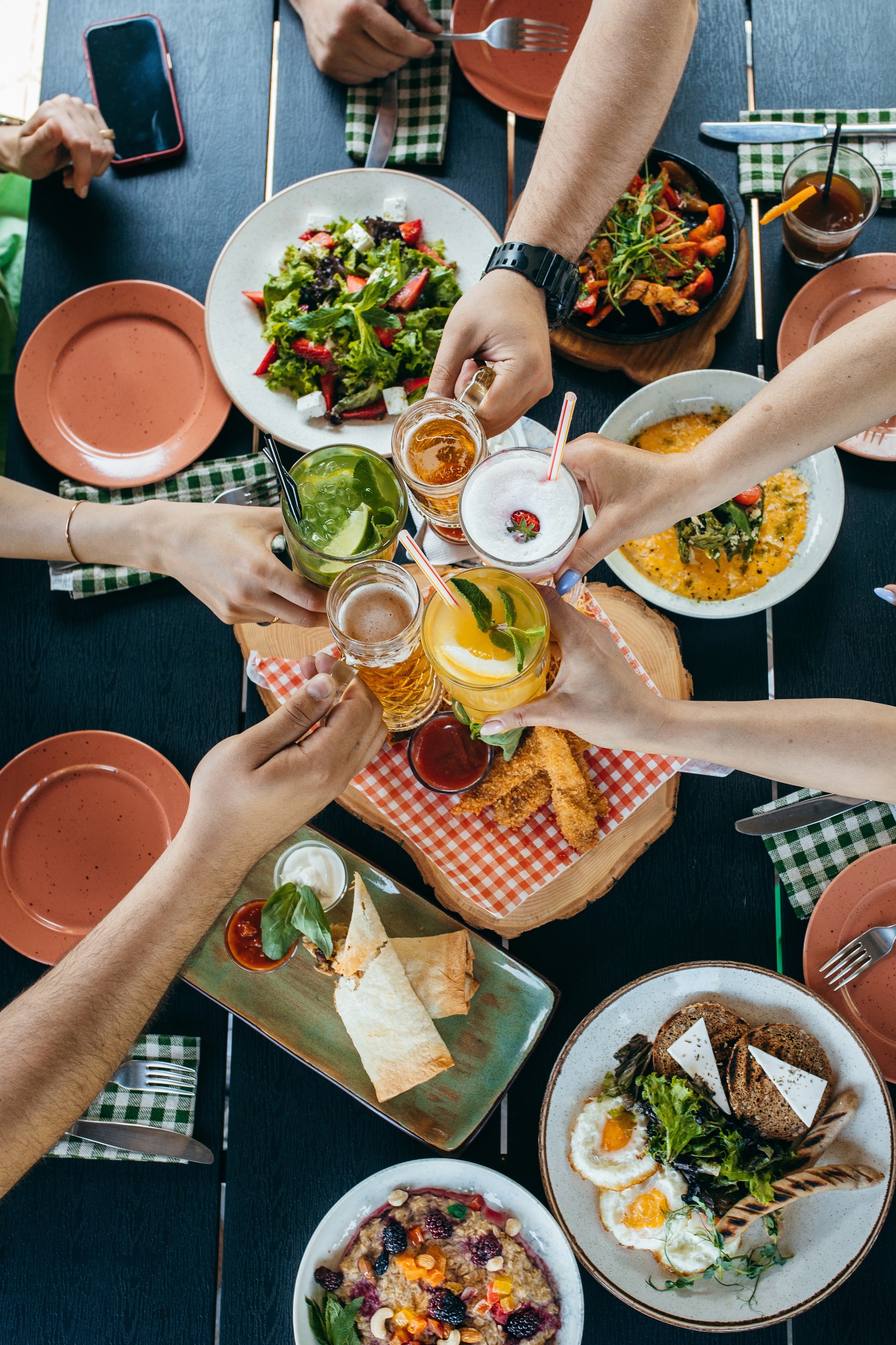 Multiple hands holding drinks stock photo