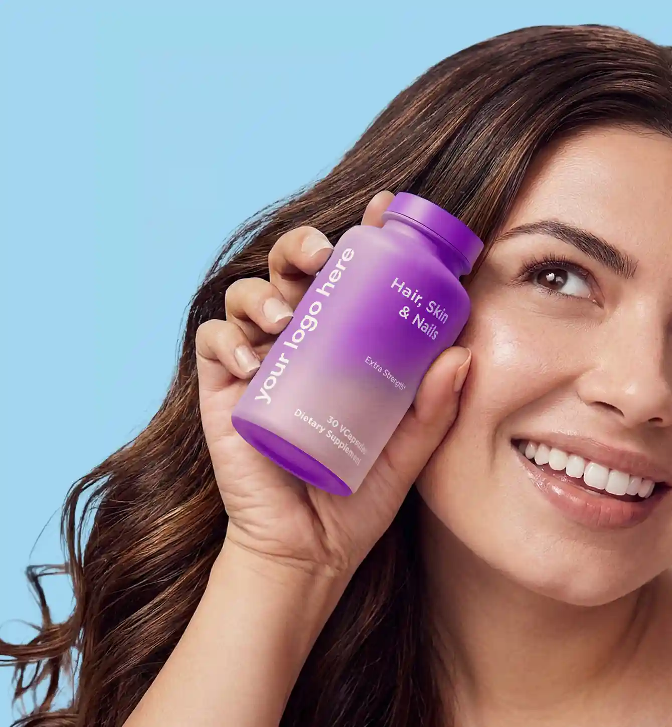 Woman holding a supplement bottle carrying a placeholder brand label