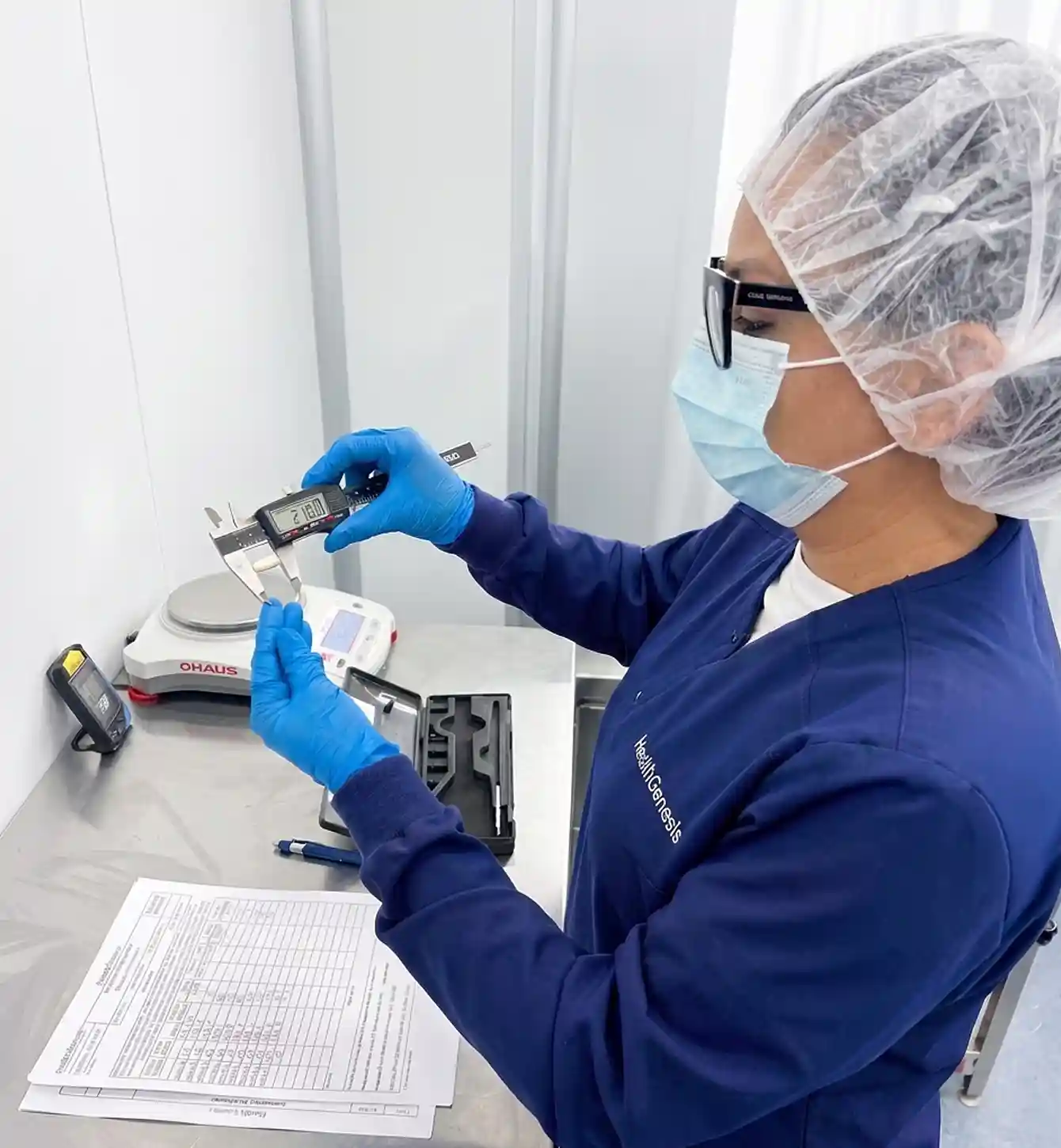 Technician handling a sample vial