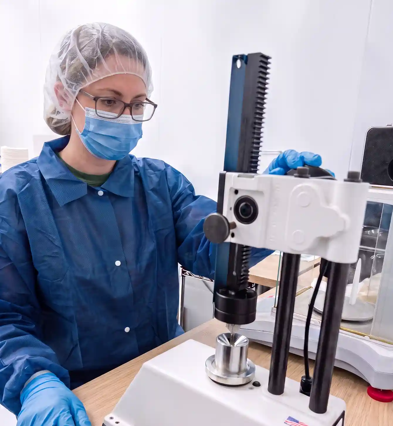 Technician using laboratory testing equipment