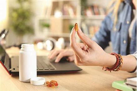 Supplement bottles and capsules for health product manufacturing display
