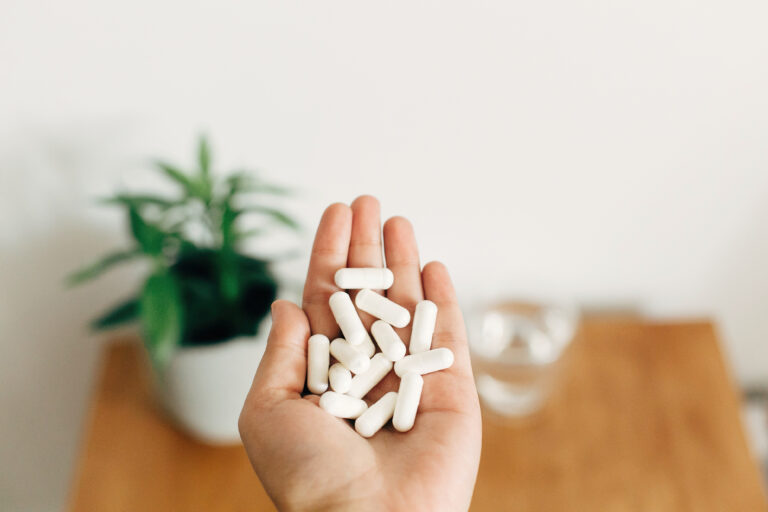 Person holding high quality magnesium supplements for health