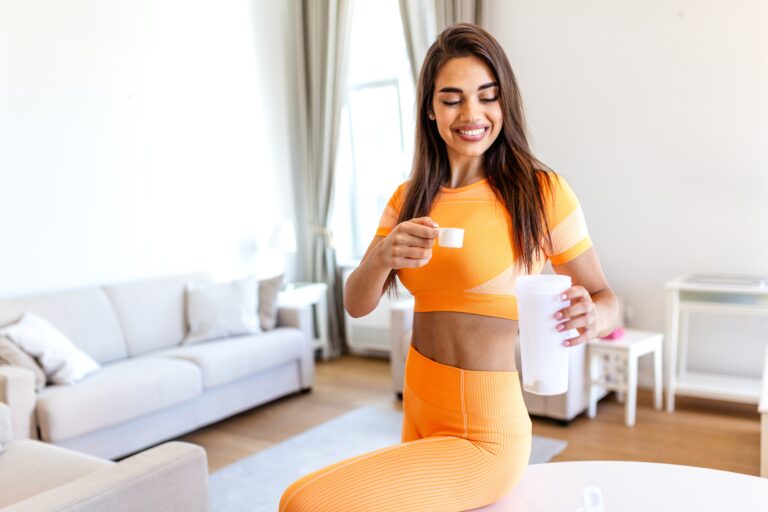 Athletic woman taking Health Genesis colostrum and protein-maxxing