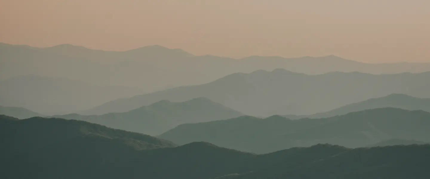 Hazy mountain range at dawn