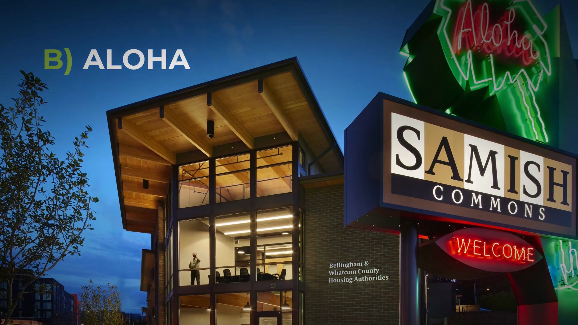 The reveal, B) Aloha, over the Samish Commons sign at dusk