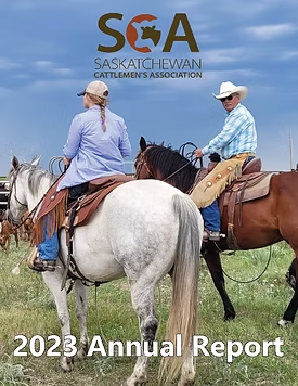 Two riders on horses in a field under a blue sky with Saskatchewan Cattlemen's Association logo above.