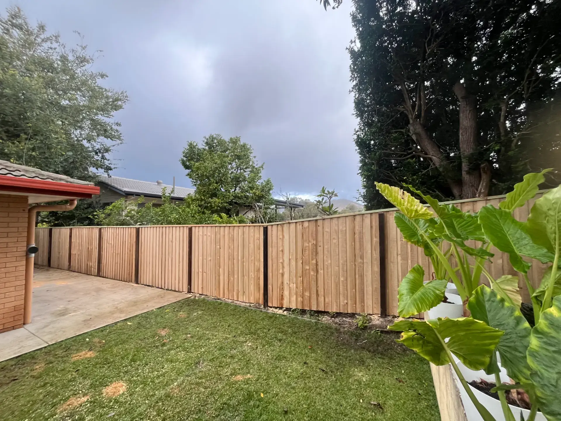 Lapped timber fence with exposed posts built by Synergy Fencing in Brisbane
