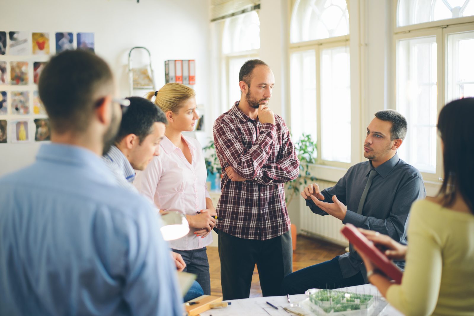 A small team talking through a problem together