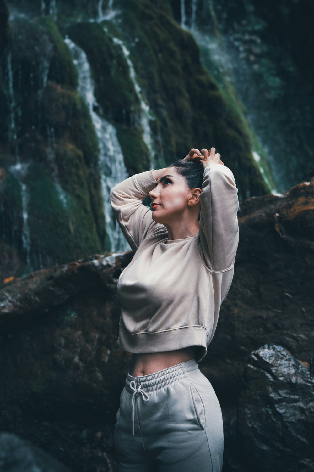 A woman hands in the air relaxing with jewelry