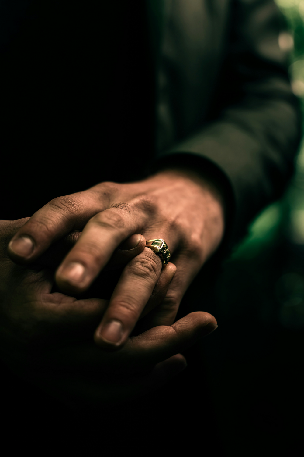 A man showing off a jewelry ring