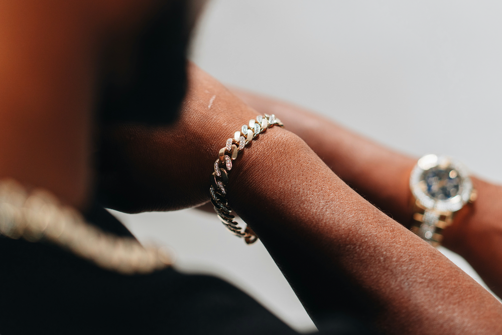 A man showing off a cuban link bracelet
