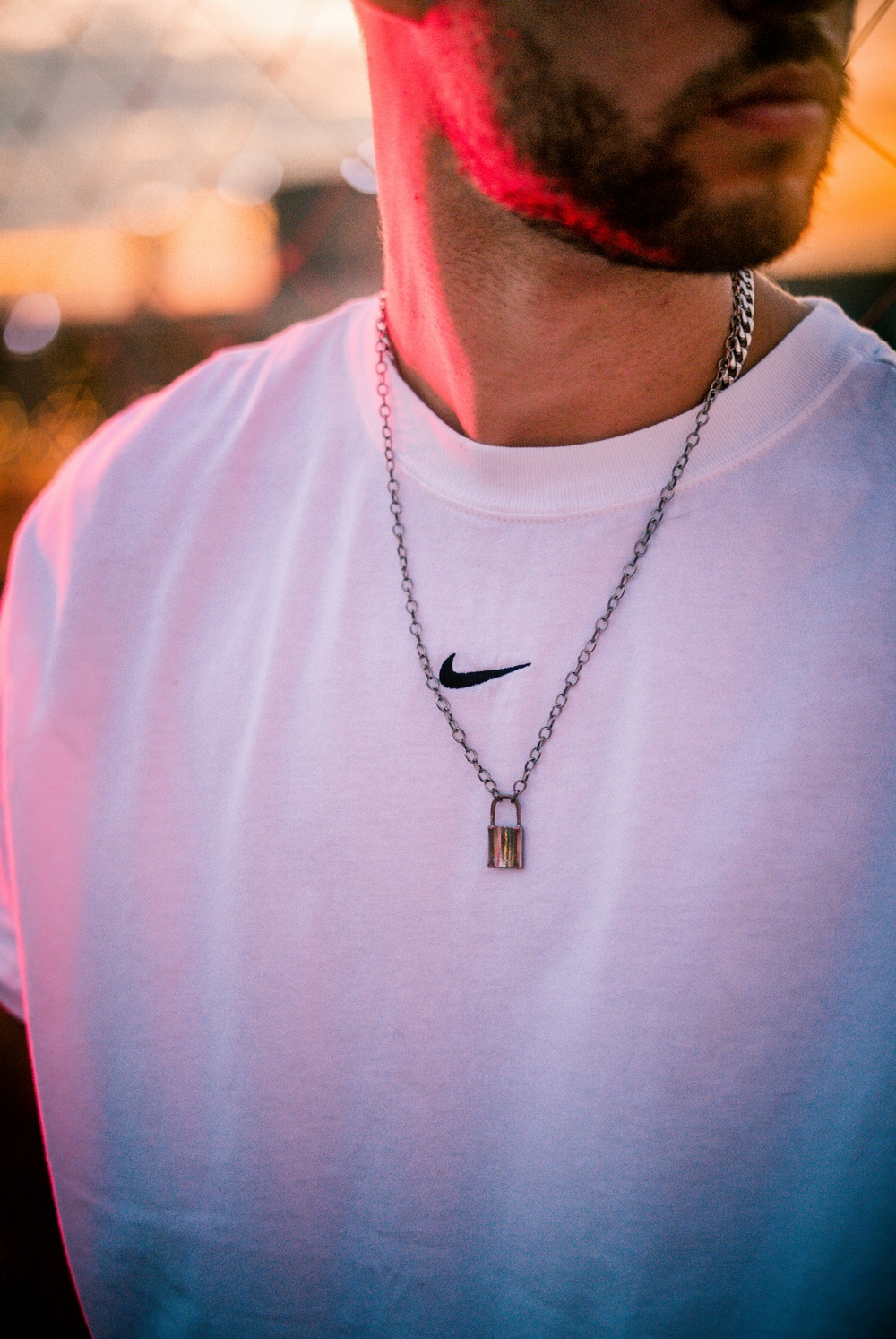 A man showing off a Silver jewelry necklace