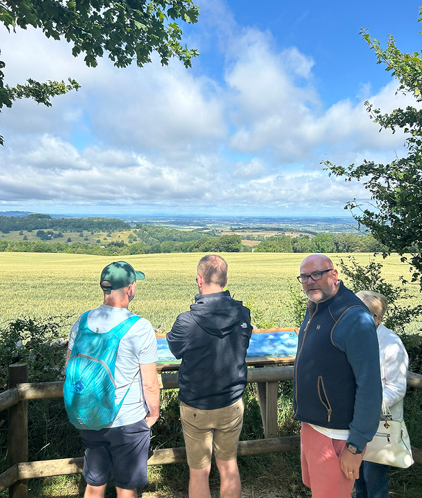 Tour guests enjoting the panoramic views from the view point at Cotswold Lavender. The view pan from Birmingh on the horizon to the Shropshire Hills, the Malvern Hills and the Black Mountains just over the Welsh border.