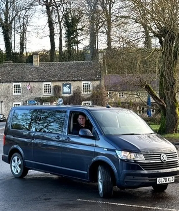 A Corf Travel van in Bibury by the bridge infront of the Swan Hotel