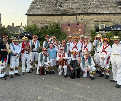 English Morris Dancers outside the Catherine Wheel, Bibury