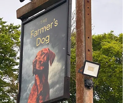 The Farmers Dog pub sign showing a labrador dog.