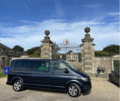 Corf Travel van parked infront of gates at Lodge Park on the Sherborne Park Estate