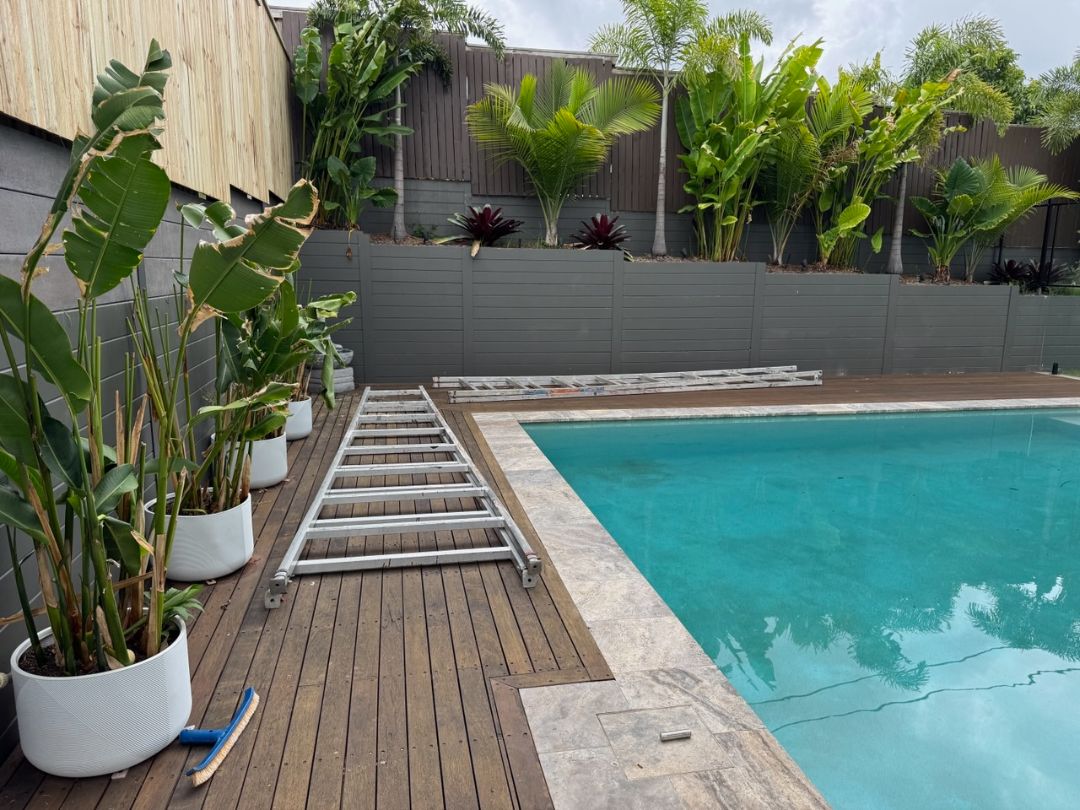 Glass pool fencing, retaining wall and colourbond fencing installed by Synergy Fencing on a residential Brisbane property