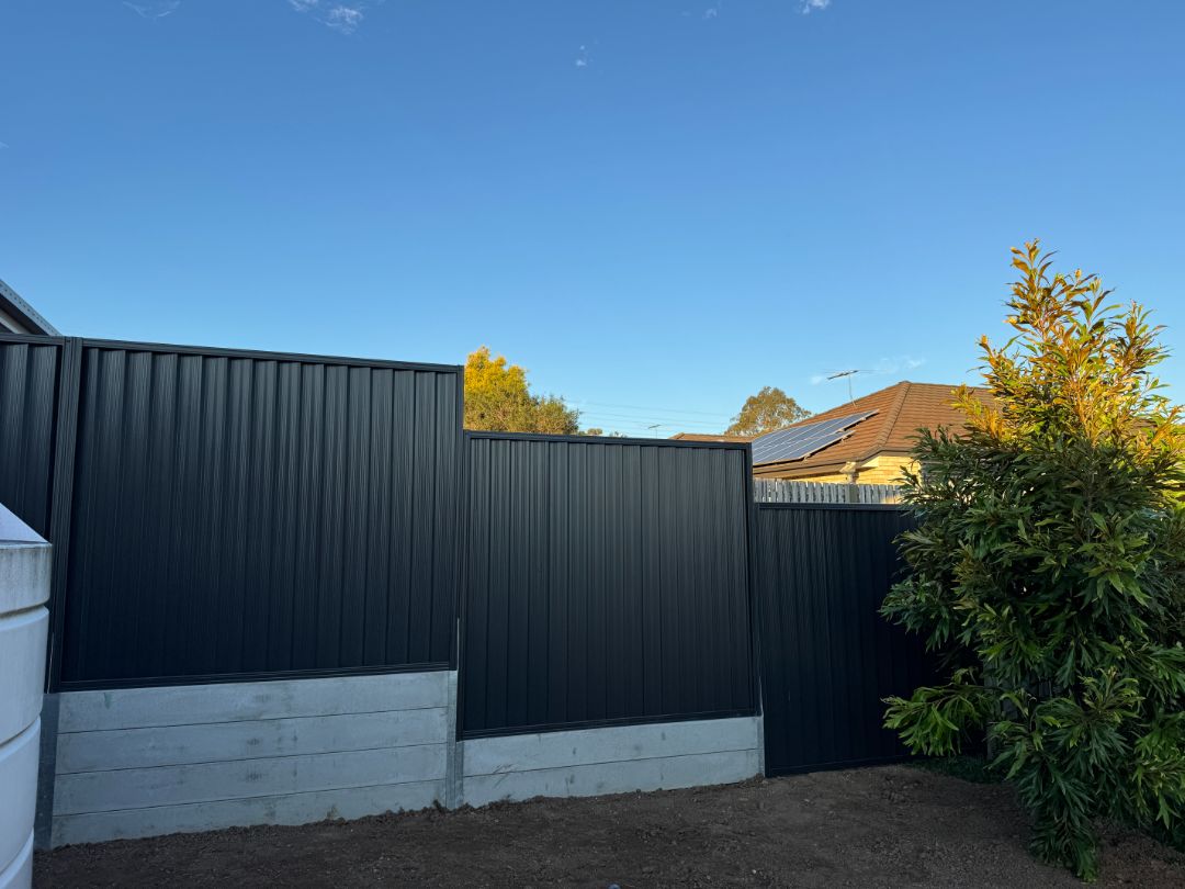 Concrete sleeper retaining wall built by Synergy Fencing for a Brisbane home