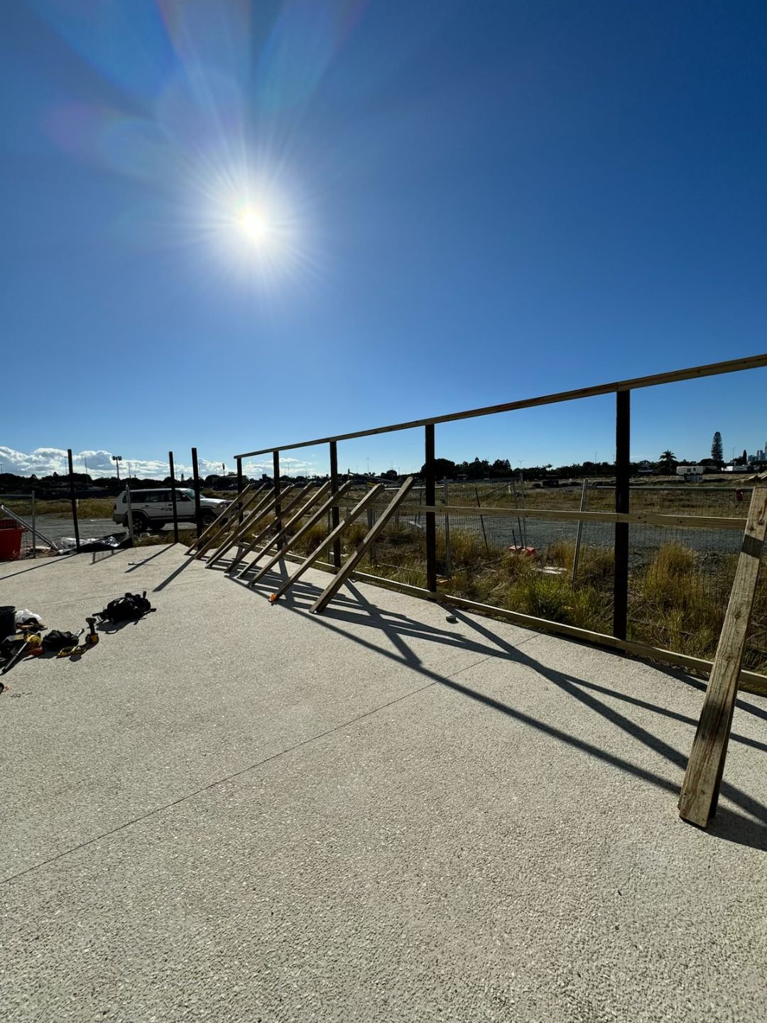 Commercial glass balustrade fencing installed by Synergy Fencing on a Brisbane rooftop pool area
