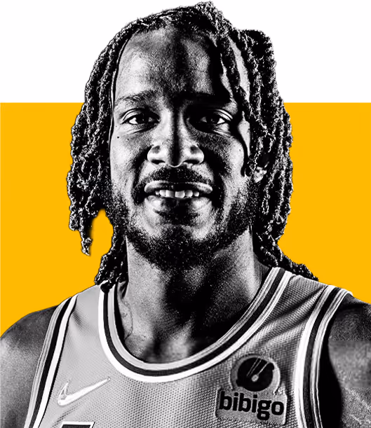 Portrait of a male basketball player with braided hair wearing a jersey with 'bibigo' and Nike logos.
