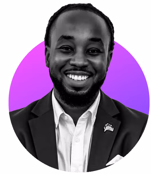 Smiling man in a suit jacket and white shirt with a purple circular background.