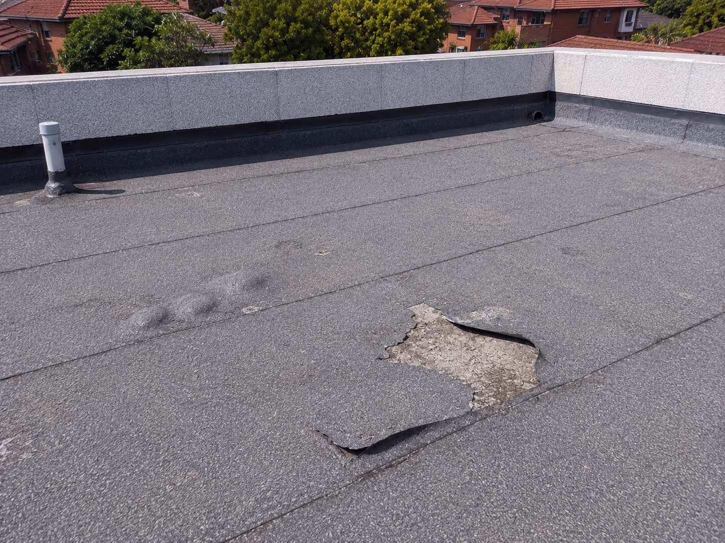 Failed waterproofing due to heavy blisters and tears