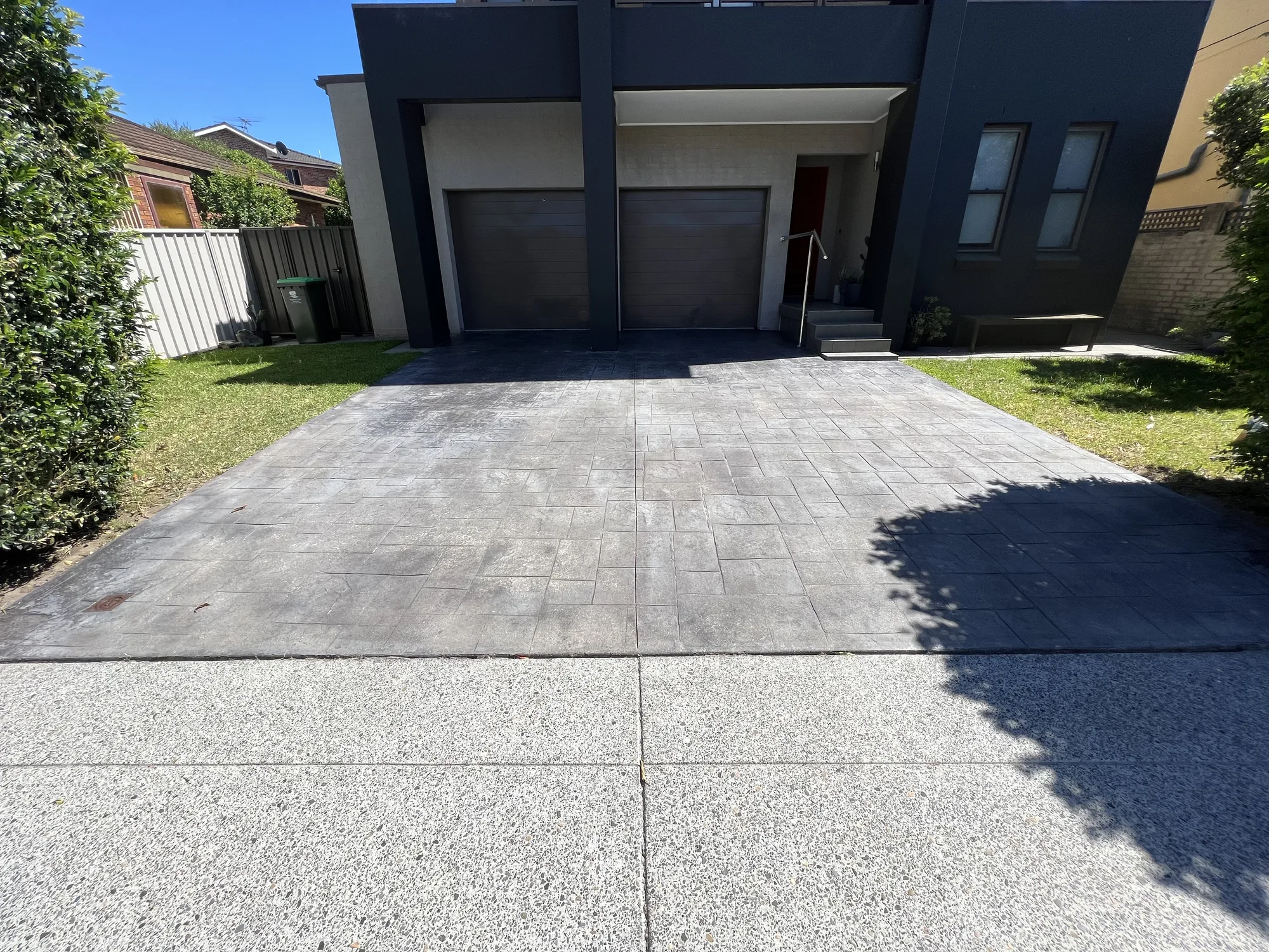 Stencil-pattern concrete driveway cleaned and ready for slip resistant paint, Sydney