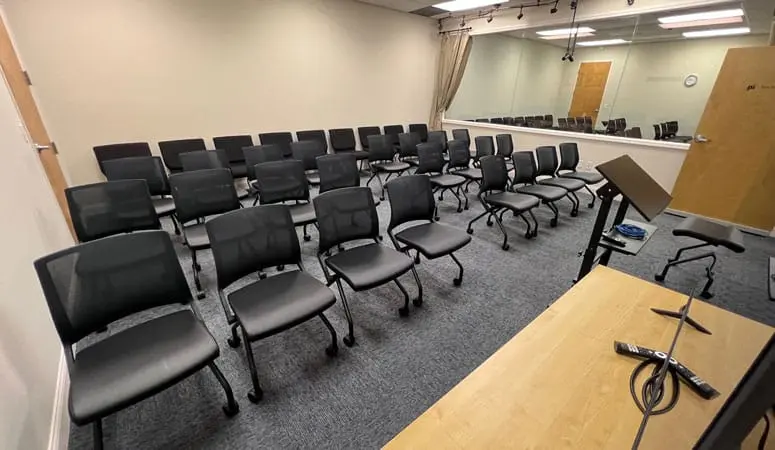 Mock trial participants seated in a jury-style research room